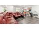 Finished basement with gray floors featuring a large sectional, recliner seating, and a concession area at 1750 Quiet Haven Cir, Indianapolis, IN 46229