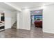 Finished basement area with gray floors, access to a bedroom, access to stairway, and TV at 1750 Quiet Haven Cir, Indianapolis, IN 46229