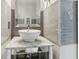 Stylish bathroom featuring a vessel sink, marble countertop, and chic grey tiled walls at 1750 Quiet Haven Cir, Indianapolis, IN 46229