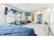 Bright and airy bedroom showcasing plush seating, a TV, and ample natural light at 1750 Quiet Haven Cir, Indianapolis, IN 46229