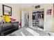 A bedroom with organized closet space and soft lighting in a neutral color scheme at 1750 Quiet Haven Cir, Indianapolis, IN 46229