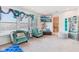 Airy bedroom with plush seating, a TV, natural light, and stylish decor at 1750 Quiet Haven Cir, Indianapolis, IN 46229