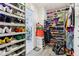 Spacious walk-in closet with shoe racks and hanging clothes at 1750 Quiet Haven Cir, Indianapolis, IN 46229