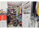 Organized walk-in closet featuring clothing racks, shoe shelves, and storage drawers at 1750 Quiet Haven Cir, Indianapolis, IN 46229