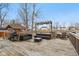 An expansive deck features comfortable outdoor seating, a grill, and pergola with outdoor lights overlooking a pond at 1750 Quiet Haven Cir, Indianapolis, IN 46229