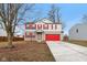 Charming two-story home with red shutters and a bright red garage door provides curb appeal at 1750 Quiet Haven Cir, Indianapolis, IN 46229