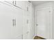 Hallway featuring a built-in wall cabinet and a white entry door at 1750 Quiet Haven Cir, Indianapolis, IN 46229