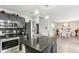 Contemporary kitchen boasting stainless steel appliances, an island, and dark cabinetry for storage at 1750 Quiet Haven Cir, Indianapolis, IN 46229