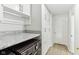 Functional laundry area with cabinetry, countertop, and utility sink, offering convenience at 1750 Quiet Haven Cir, Indianapolis, IN 46229