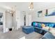 A cozy living room with modern decor, featuring a stylish blue sectional sofa at 1750 Quiet Haven Cir, Indianapolis, IN 46229