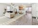 Open living room featuring modern furnishings, beautiful chandeliers, and new vinyl plank flooring at 1750 Quiet Haven Cir, Indianapolis, IN 46229