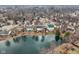 An aerial view of a pond behind several houses at 1750 Quiet Haven Cir, Indianapolis, IN 46229