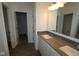 Bathroom featuring double sinks, spacious countertop, and modern fixtures at 1841 James Pierce Dr, Shelbyville, IN 46176