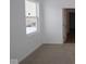 Bright bedroom with neutral carpet and large window bringing in natural light at 1841 James Pierce Dr, Shelbyville, IN 46176