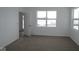 Neutral bedroom with carpet and abundant natural light through a large window at 1841 James Pierce Dr, Shelbyville, IN 46176