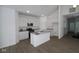 Spacious, modern kitchen featuring white cabinetry, stainless steel appliances, a central island, and hardwood floors at 1841 James Pierce Dr, Shelbyville, IN 46176