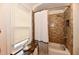 Bathroom showcasing bathtub, tiled shower, and window for natural light at 19 Orchard Ln, Anderson, IN 46011