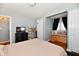 Bedroom features include natural lighting, cushioned headboard, dark dresser and a window seat at 19 Orchard Ln, Anderson, IN 46011