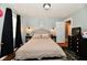 Bedroom features include a cushioned headboard, two side tables with lighting, and dark curtains at 19 Orchard Ln, Anderson, IN 46011