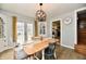 Charming dining room featuring hardwood floors, a rustic table, and lots of natural light at 19 Orchard Ln, Anderson, IN 46011