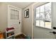 Entryway featuring two white doors and a view of the neighborhood at 19 Orchard Ln, Anderson, IN 46011