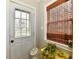 Mudroom featuring a window door, a window, and a bamboo blind at 19 Orchard Ln, Anderson, IN 46011