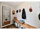 Hallway featuring a wooden bench with wall hooks and decor at 19 Orchard Ln, Anderson, IN 46011