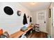 Hallway featuring a wooden bench with wall hooks and decor at 19 Orchard Ln, Anderson, IN 46011