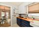 Kitchen view showing the blue cabinets, wood countertops, and view into dining room at 19 Orchard Ln, Anderson, IN 46011