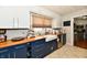 Bright kitchen features blue cabinets, wood countertops, and stainless steel appliances at 19 Orchard Ln, Anderson, IN 46011