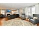 Spacious living room featuring hardwood floors, a fireplace, and comfortable seating at 19 Orchard Ln, Anderson, IN 46011