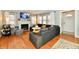 Cozy living room featuring a fireplace, hardwood floors, and a comfortable gray sectional at 19 Orchard Ln, Anderson, IN 46011