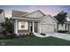 Charming single-story home with gray siding, a two-car garage, and well-maintained landscaping at 19499 Mcbee Ave, Westfield, IN 46074
