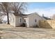 Exterior of home showing the backyard area, AC unit, fence, and gravel parking area at 218 E Carlisle St, Mooresville, IN 46158
