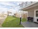 Grassy backyard with a covered patio and outdoor cooking area including a Blackstone grill at 218 E Carlisle St, Mooresville, IN 46158