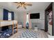Bright bedroom features a built-in bunk bed, a television and storage space at 218 E Carlisle St, Mooresville, IN 46158