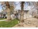 Traditional-style home with a pleasant facade, enhanced by mature trees and a welcoming front porch at 218 E Carlisle St, Mooresville, IN 46158