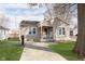 Charming bungalow home with cozy front porch and well-maintained lawn, exuding curb appeal at 218 E Carlisle St, Mooresville, IN 46158