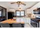 Stylish kitchen featuring white cabinets, a butcher block island, and modern appliances at 218 E Carlisle St, Mooresville, IN 46158