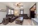Cozy living room featuring comfortable seating, modern ceiling fan, and an abundance of natural light at 218 E Carlisle St, Mooresville, IN 46158