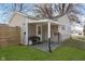 View of the covered patio featuring concrete flooring and outdoor cooking area at 218 E Carlisle St, Mooresville, IN 46158
