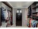 Spacious walk-in closet with organized shelving and hanging space, plus a secure safe at 218 E Carlisle St, Mooresville, IN 46158