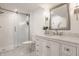 Bathroom with a glass-enclosed shower, vanity with marble countertop, and sconce lighting at 220 Pine Dr, Indianapolis, IN 46260