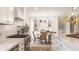 Well-equipped kitchen that seamlessly blends into a breakfast nook with an adjacent dining area at 220 Pine Dr, Indianapolis, IN 46260