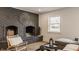 Cozy living room featuring a striking dark brick fireplace and modern decor at 220 Pine Dr, Indianapolis, IN 46260
