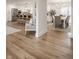 Open-concept living space flows into dining and kitchen areas with great hardwood floors at 220 Pine Dr, Indianapolis, IN 46260