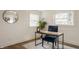 Bright office space with natural light, hardwood floors, and a stylish blue chair at 220 Pine Dr, Indianapolis, IN 46260