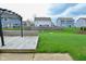 A well-maintained backyard featuring a wooden deck, a metal pergola, and lush green grass at 2336 Boneset Dr, Plainfield, IN 46168
