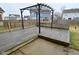 Wooden deck with metal pergola, overlooking the backyard and nearby houses at 2336 Boneset Dr, Plainfield, IN 46168