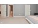 Comfortable bedroom with ensuite bathroom entrance, bathed in natural light from a window at 2336 Boneset Dr, Plainfield, IN 46168